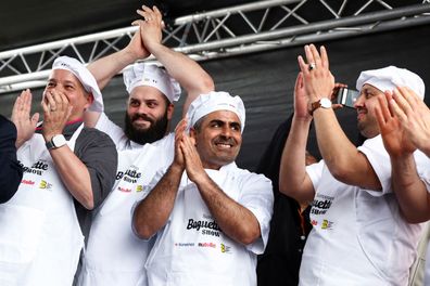 French bakers react after breaking the record for the longest bagette in the world measuring 140.53 meters long.