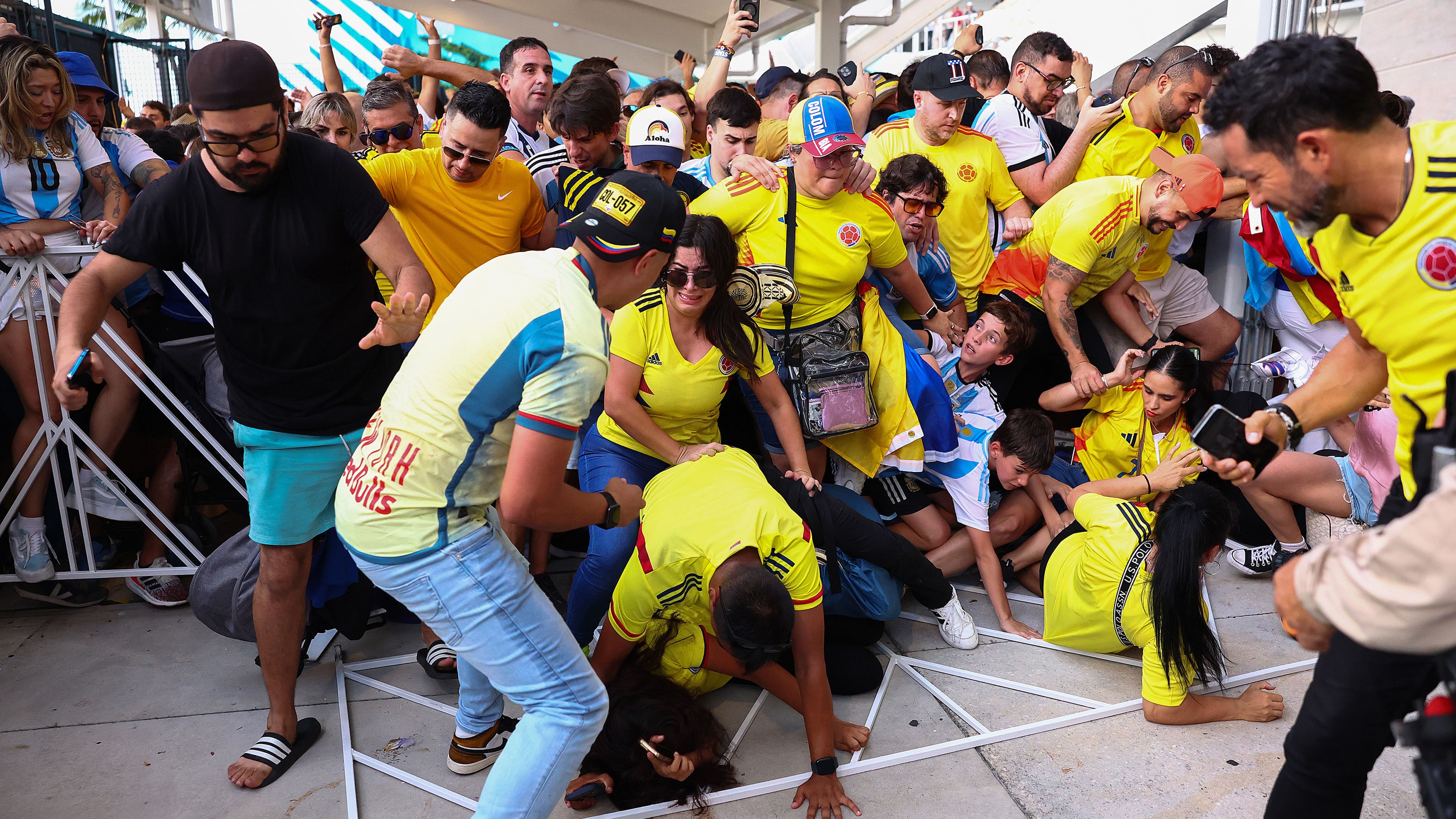 Fans of Colombia and Argentina try to pass the gate amid disturbances ahead of the Copa America 2024 final.