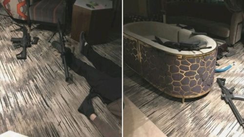 Paddock's body on the floor of the hotel room and a couch loaded with guns. (Supplied)