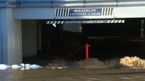 Water from Richmond river in Ballina pours into an RSL carpark.