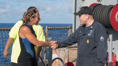 Mariner Jennifer Appel greets USS Ashland Command Master Chief Gary Wise. (US Navy)