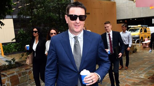 Andrew Whelan, former general manager for Gold Coast Tobacco mogul Travers "Candyman" Beynon, arrives at the Federal Court in Brisbane. Whelan is suing Benyon for unfair dismissal. (AAP)