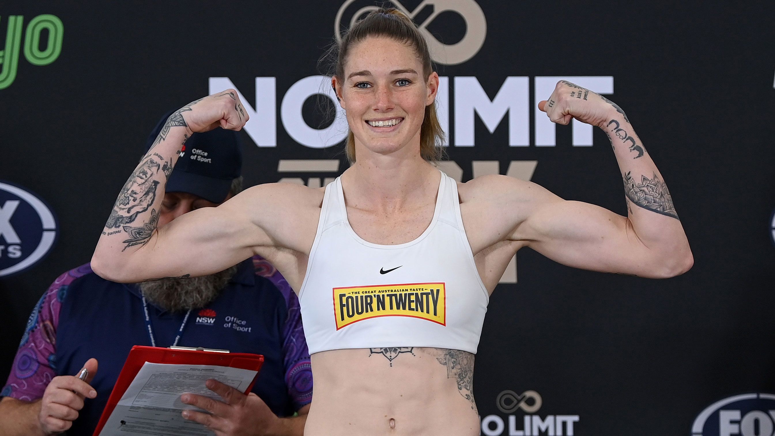 Tayla Harris flexes at a weigh in for a fight in July, 2023.