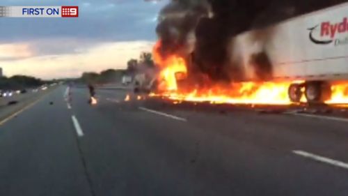 Despite being on fire for around 45 seconds, the driver managed to escape with only minor injuries. (9NEWS)