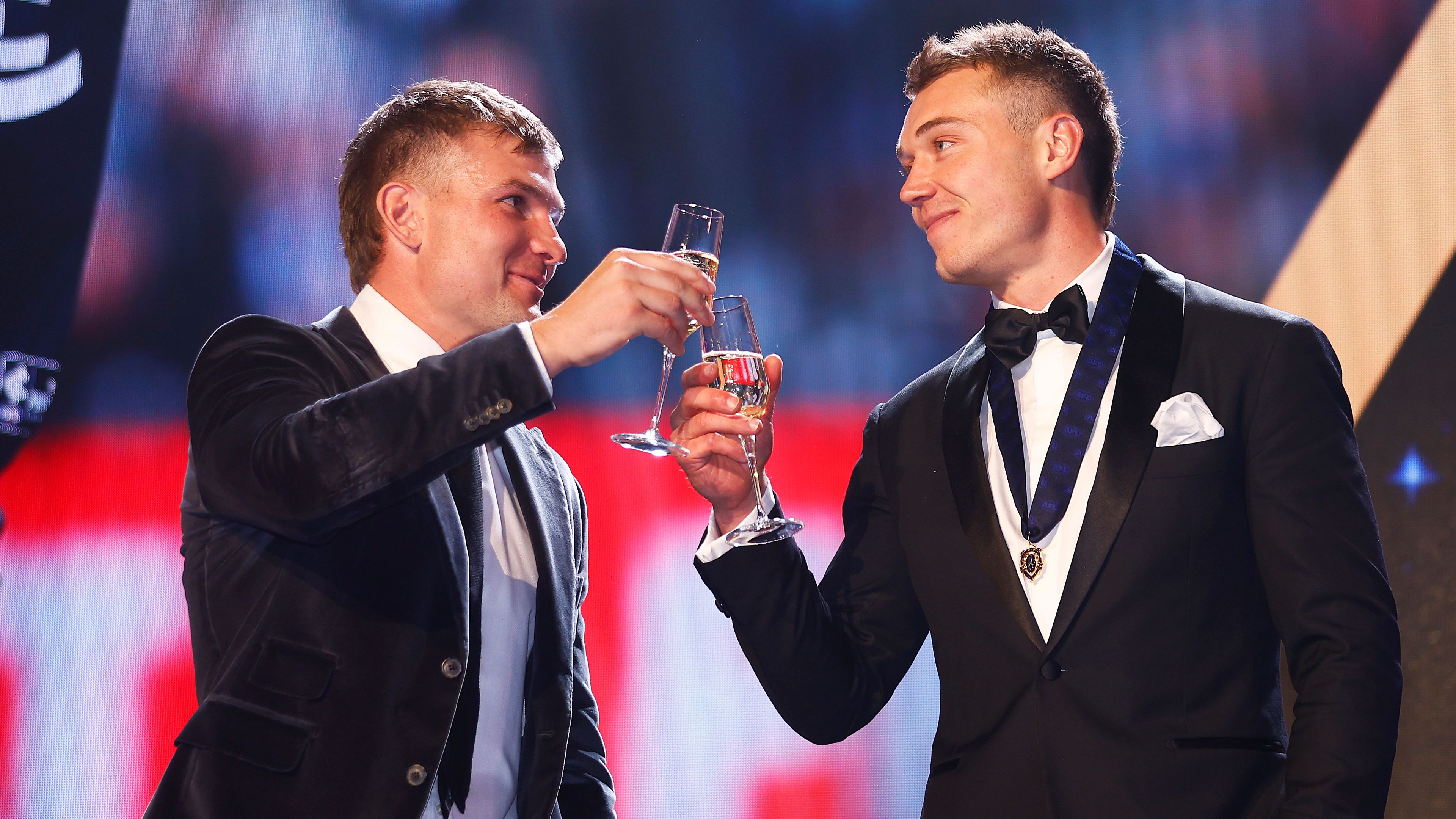 Patrick Cripps of the Blues (R) is congratulated by Ollie Wines of the Power after winning the Brownlow Medal during the 2022 Brownlow Medal at Crown Entertainment Complex on September 18, 2022 in Melbourne, Australia. (Photo by Daniel Pockett/AFL Photos/via Getty Images)