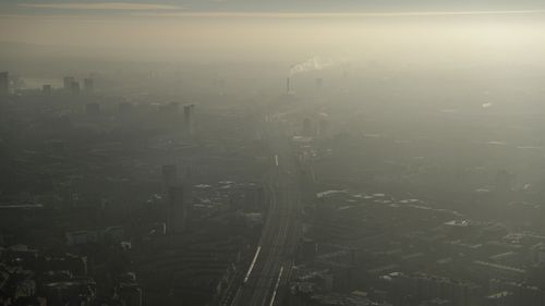 This January, 2017 file photo shows the pollution haze over South East London, through a window in a viewing area of the 95-storey skyscraper The Shard, the tallest building in Britain.