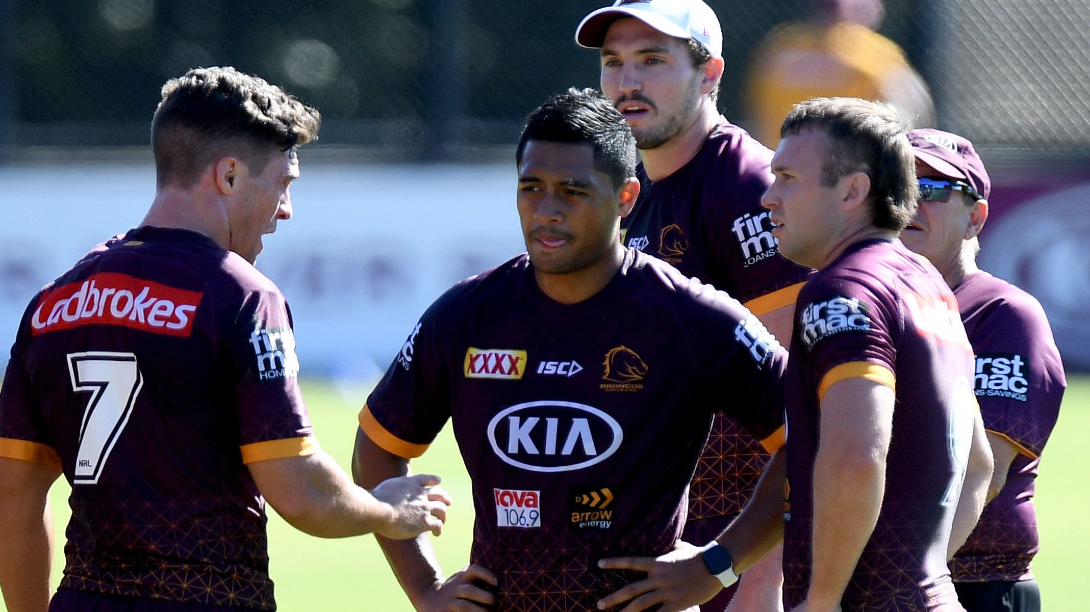 Broncos halves Brodie Croft and Anthony Milford locked in discussion with hooker Jake Turpin.