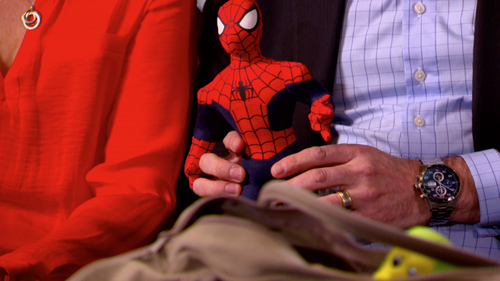 William's parents hold his Spider-man toy. (9NEWS)