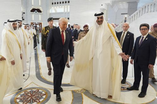 Qatar's Emir Sheikh Tamim bin Hamad Al Thani welcomes President Donald Trump 