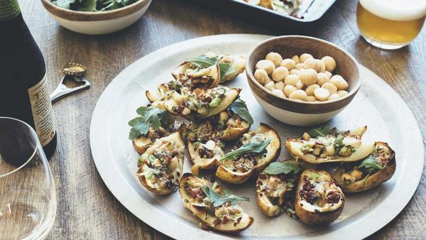 Roasted potato skins with macadamias, bacon, rocket and blue c