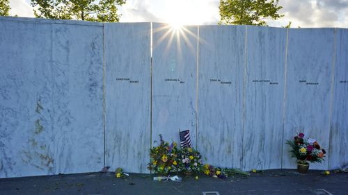 The sun sets behind The Wall of Names at the Flight 93 National Memorial in Shanksville, Pennsylvania.