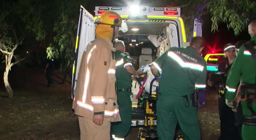 The man was lifted out of the drain and taken to hospital before being arrested for offences linked to an outstanding warrant. Picture: 9NEWS.