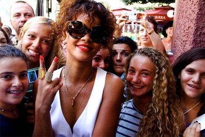 Rihanna shares pics of her vacation sailing around the coast of Italy.<br/><br/>"My girls" ...meeting her young Italian fans.