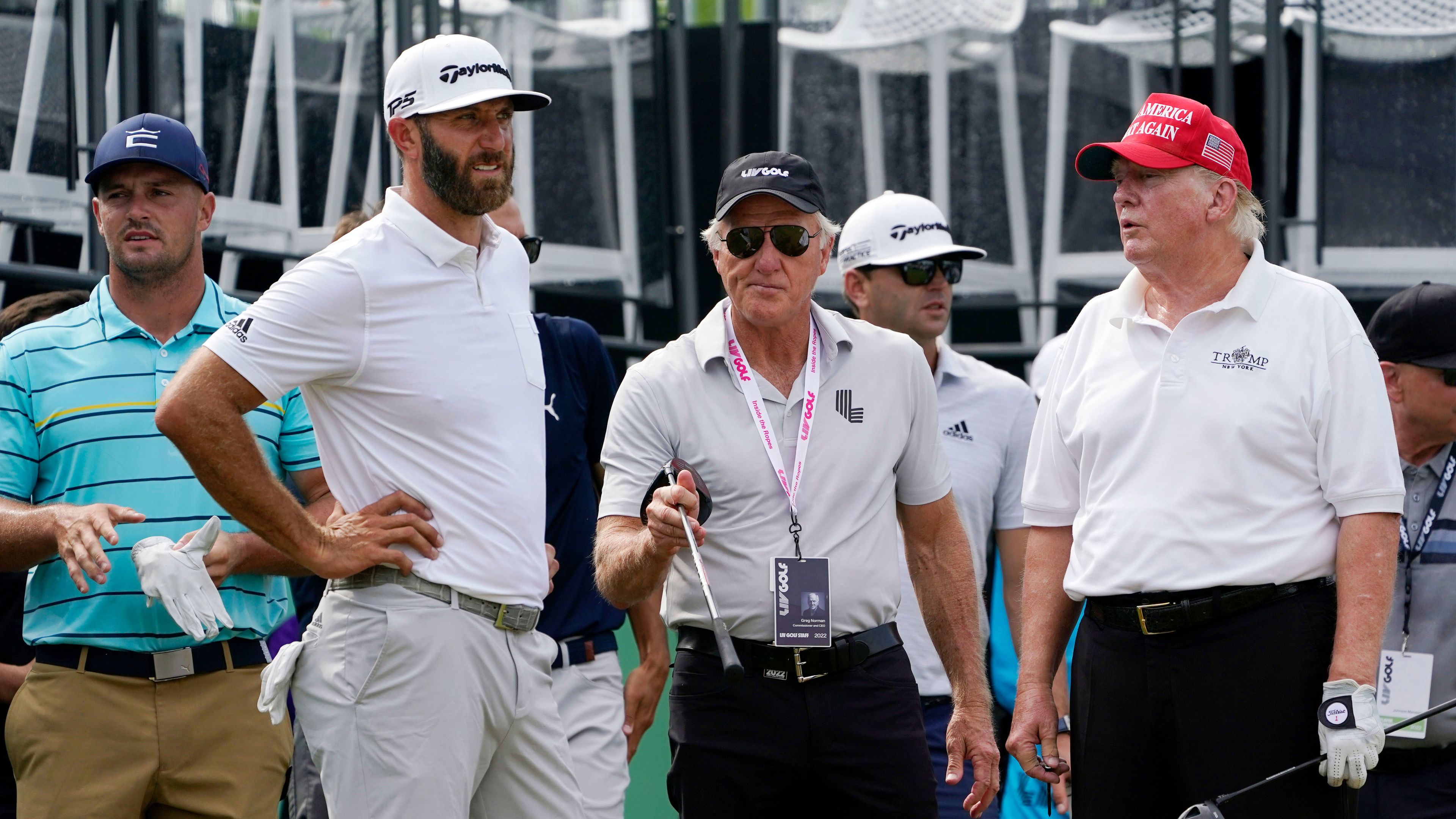 Dustin Johnson, Greg Norman and Donald Trump at the pro-am of a LIV Golf tournament.