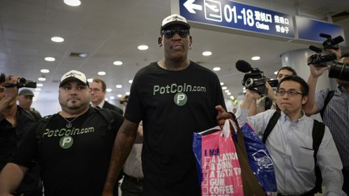 Rodman at Beijing's international airport. (AFP)