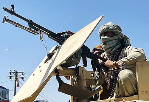 Taliban soldier manning armoured vehicle gun (Getty)