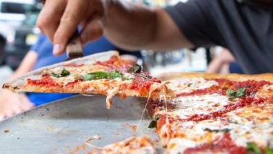 NEW YORK, NEW YORK - JULY 07: A Margherita pie is seen served at the famous Lombardi's Pizza amid the COVID-19 pandemic on July 07, 2020 in New York, New York. In 1905, Lombardi's Pizza was recognized as the First Pizzeria in the United States. Amid the coronavirus pandemic, Lombardi's has reopened its doors once again. (Photo by Arturo Holmes/Getty Images)