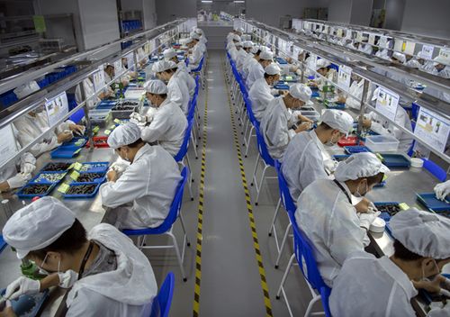 Workers assemble parts for e-cigarettes on the production line at Kanger Tech, one of China's leading manufacturers of vaping products.