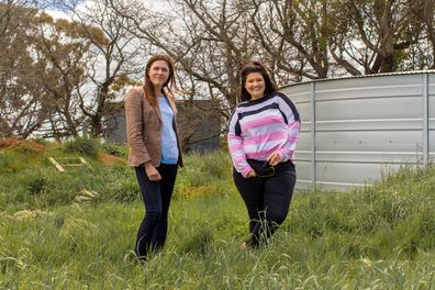 Kate and Tanya in front of the Hook family's water tank.