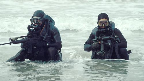 Navy SEALs in action.