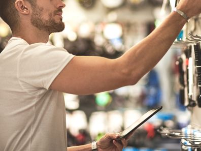 man shopping for cables.