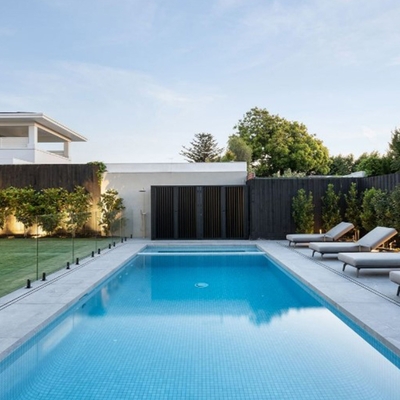 Circular pavers resembling giant lily pads lead to the front door at this Melbourne home