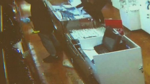 Masked men stormed the Elsternwick shop, smashing the cabinets with hammers. (9NEWS)