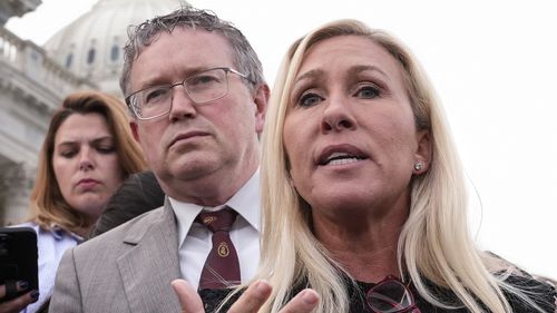 Thomas Massie (left) and Marjorie Taylor Greene (right).