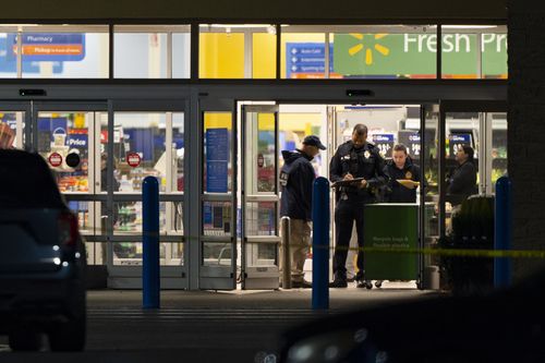 Law enforcement, including the FBI, work at the scene of a mass shooting at a Walmart, Wednesday, November 23, 2022, in Chesapeake, Virginia