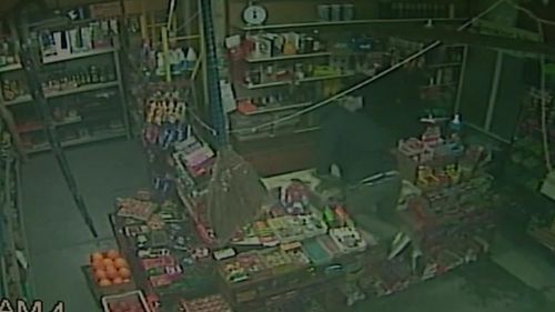 The masked men threw the cash register the floor and attempted to kick it open. (9NEWS) 