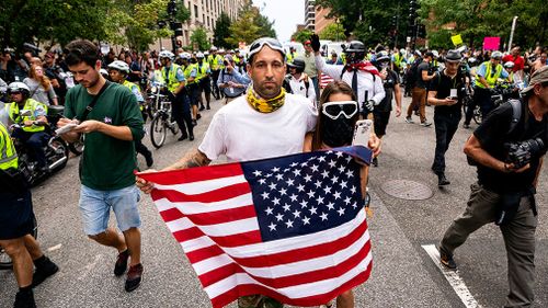 Some members of the alt-right carried American flags.