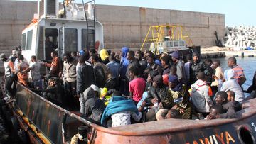 An oil tanker helped rescue about 135 people from boats off the Libyan coast. (AFP)