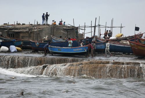 A fishing boat being to a safer ground on the Arabian Sea coast in Veraval, Gujarat, India. (AP Photo/Ajit Solanki)