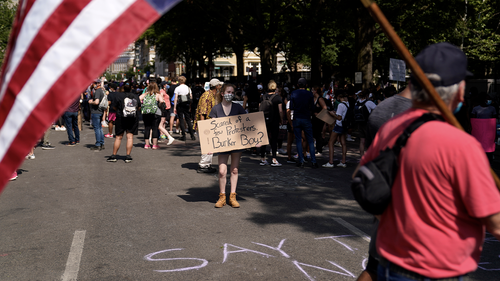 Demonstrators protest, Thursday, June 4, 2020, near the White House in Washington, over the death of George Floyd. (AP Photo/Evan Vucci)