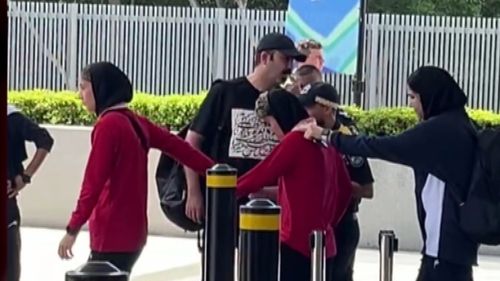 Protesters have tried to block a bus taking the Iranian women's football team from their hotel on the Gold Coast to the airport and out of Australia after five members of the side who escaped their handlers were granted asylum by the federal government. Members of the team appeared to pull one player towards the bus as the team﻿ left the RACV Royal Pines Resort this afternoon.