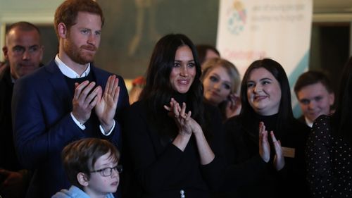 Prince Harry and Meghan Markle during a reception for young people at the Palace of Holyroodhouse. (AAP)