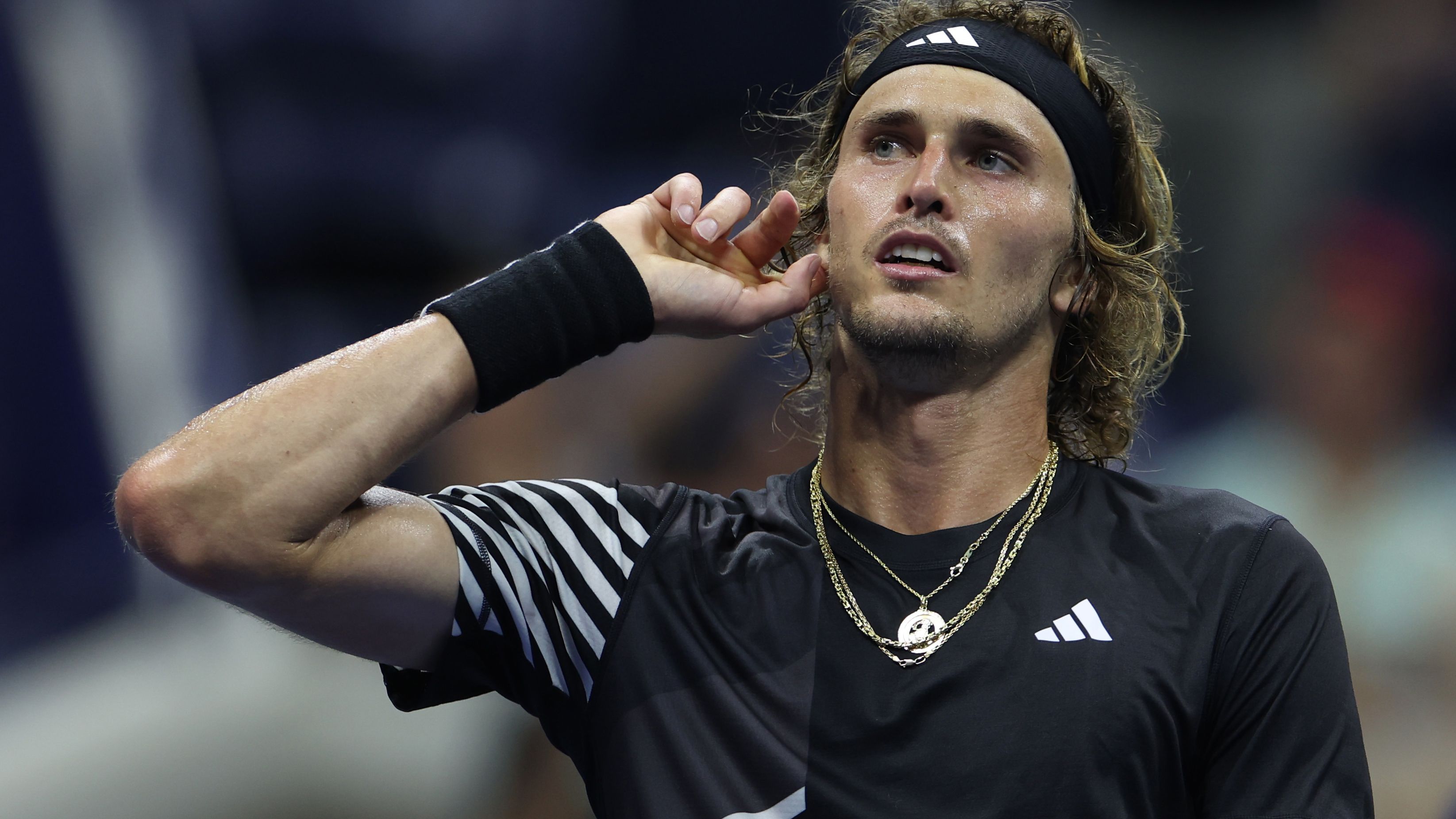 Alexander Zverev wills on fans during the fifth set.