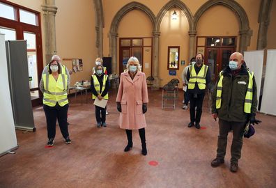 The Duchess of Cornwall poses for a photograph with volunteers during a visit to the Community Vaccination Centre at St Paul's Church, Croydon, where she thanked NHS staff and church representatives supporting the UK vaccination rollout. Picture date: Wednesday March 3, 2021. 