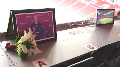 Flowers are placed in memory of Grant Wahl, an American sports journalist who passed away whilst reporting on the Argentina and Netherlands match, prior to the FIFA World Cup Qatar 2022 quarter final match between England and France.