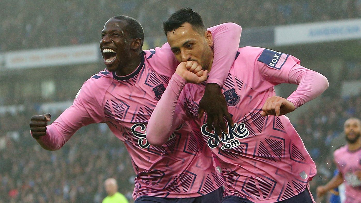 Dwight McNeil of Everton celebrates with teammate Abdoulaye Doucoure after scoring the team&#x27;s fourth goal during the Premier League match between Brighton &amp; Hove Albion and Everton FC at American Express Community Stadium on May 08, 2023 in Brighton, England. (Photo by Charlie Crowhurst/Getty Images)
