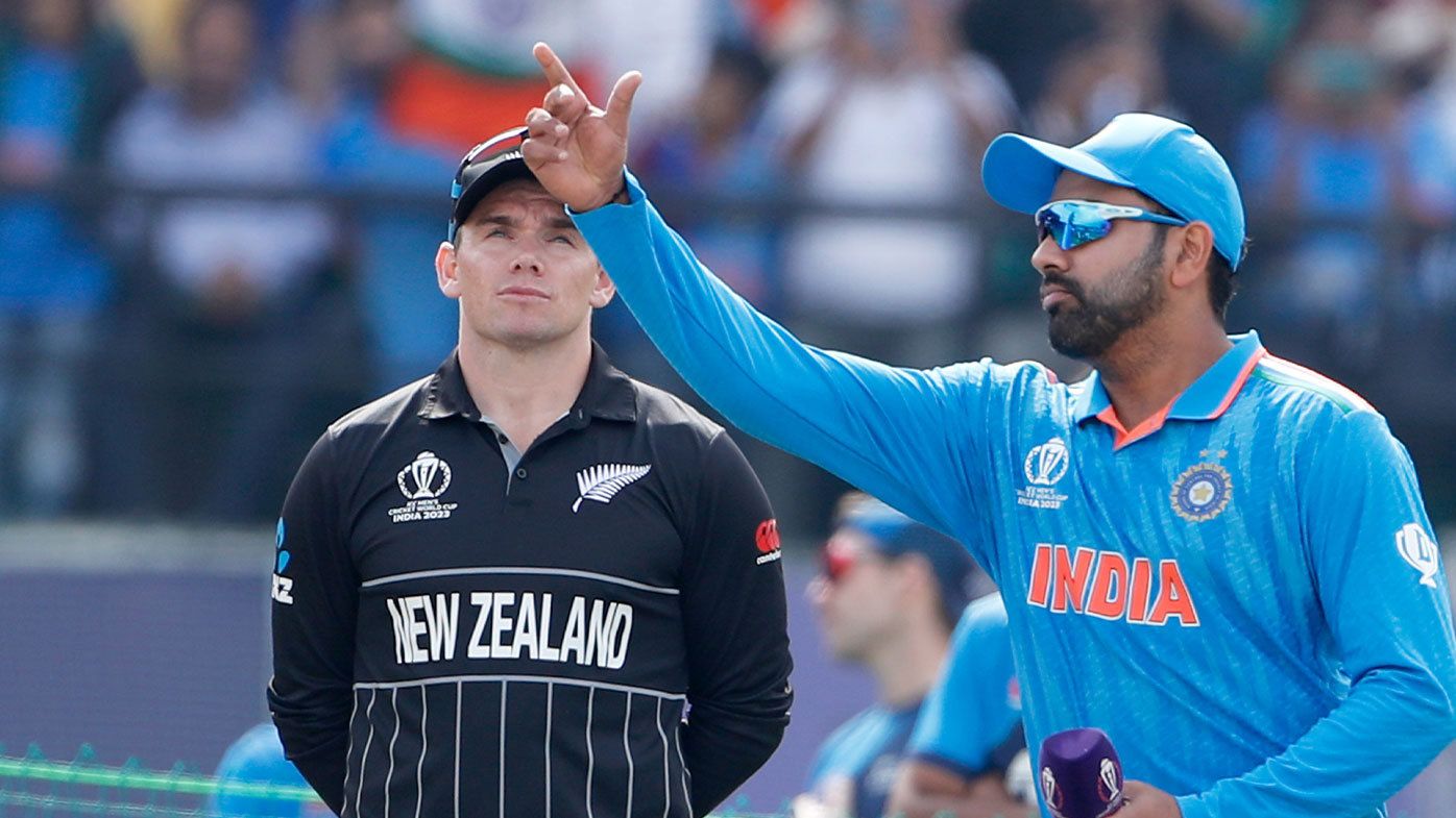 Indian captain Rohit Sharma tosses the coin against New Zealand