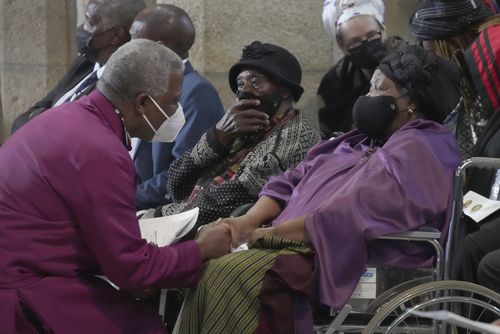 Anglican Archbishop of Cape Town, Thabo Makgoba, left, widow Leah Tutu at the funeral of Anglican Archbishop Emeritus Desmond Tutu   in St. Georges Cathedral in Cape Town, South Africa, Saturday, Jan. 1, 2022. 