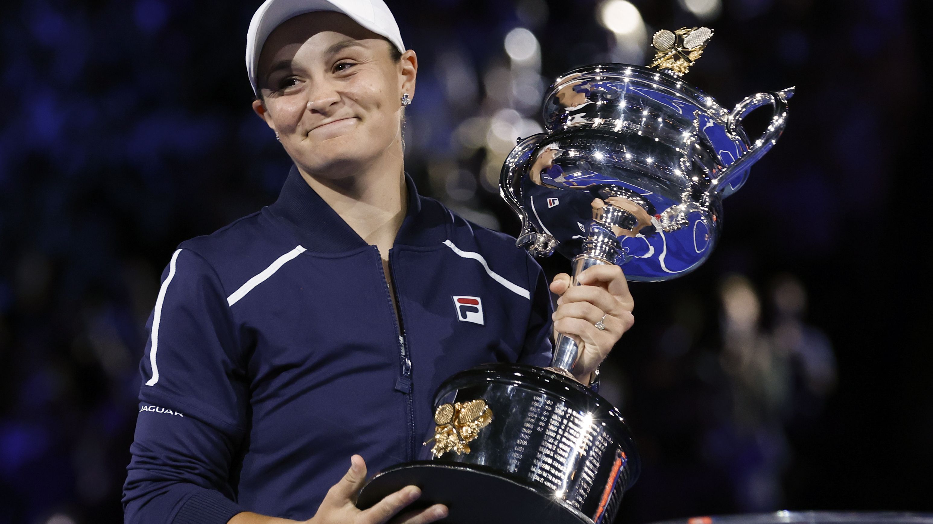 Ash Barty holds the Daphne Akhurst Memorial Cup after defeating Danielle Collins in the women&#x27;s singles final at the Australian Open.