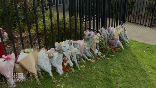 Floral tributes outside the school.