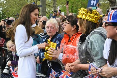 Catherine, Princess of Wales, meets well-wishers during a walkabout on the Mall outside Buckingham Palace ahead of the coronation of Britain's King Charles and Camilla, Queen Consort on May 5, 2023 in London 
