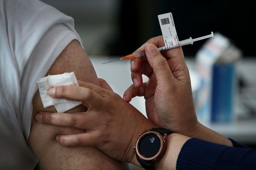 A nurse administers the Pfizer vaccine to a client at a pop-up clinic at the Lebanese Muslim Association (LMA) in Lakemba last month.