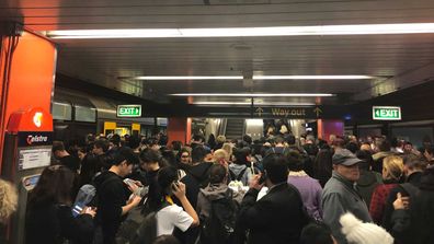 Passengers are packed onto the platform at Central Station.