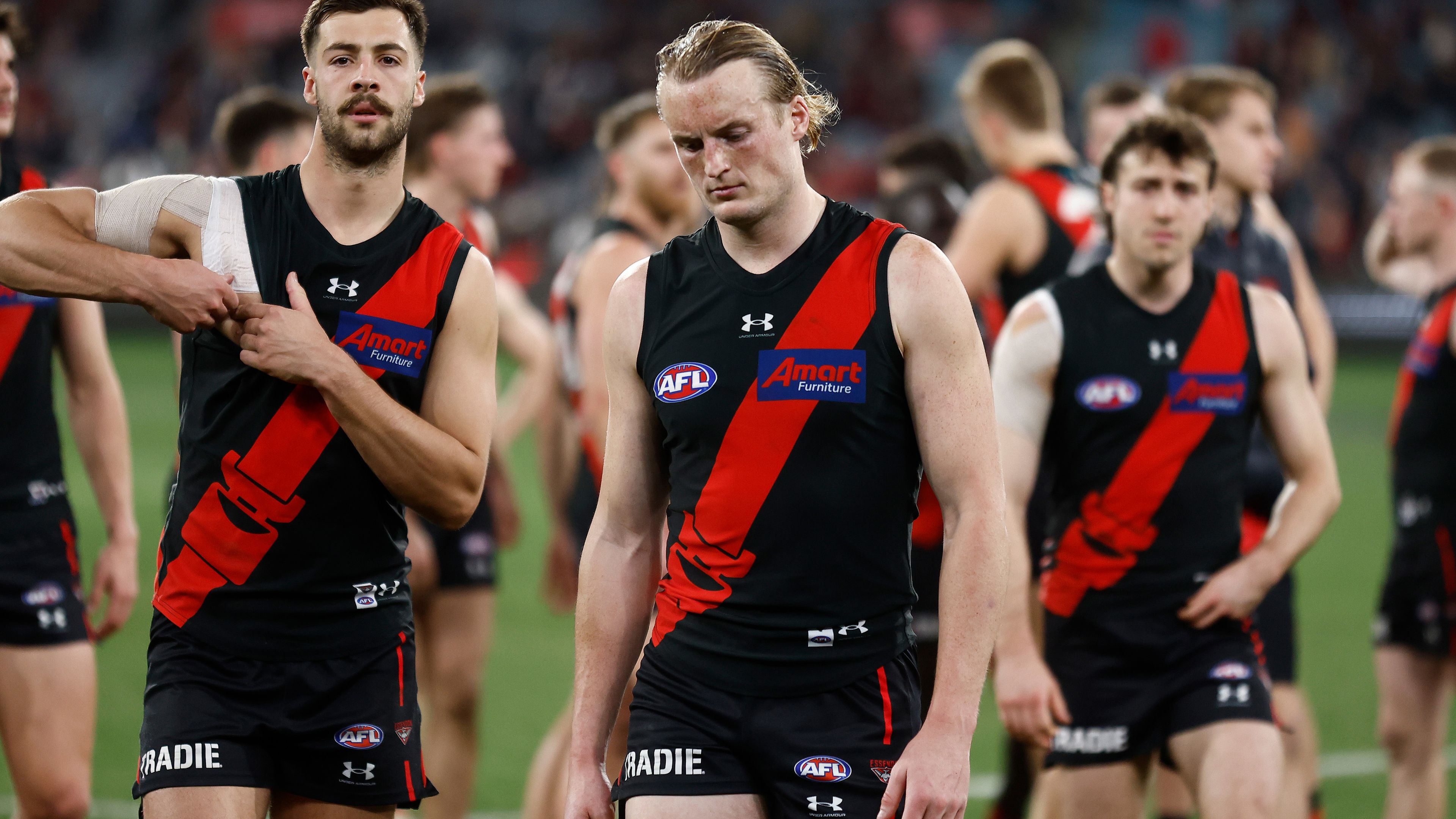 MELBOURNE, AUSTRALIA - AUGUST 25: Mason Redman of the Bombers looks dejected after a loss during the 2023 AFL Round 24 match between the Essendon Bombers and the Collingwood Magpies at Melbourne Cricket Ground on August 25, 2023 in Melbourne, Australia. (Photo by Michael Willson/AFL Photos via Getty Images)