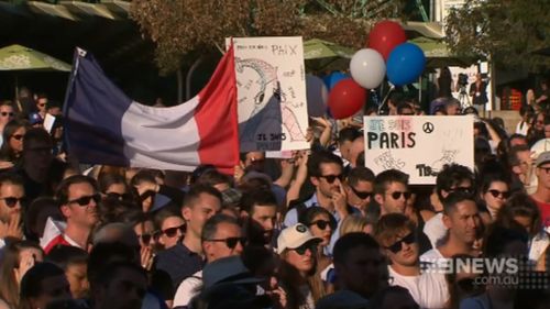About 3000 people attended a vigil in Melbourne's Federation Square. (9NEWS)