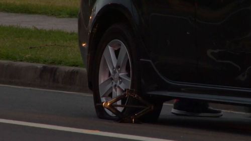 The 23-year-old man was struck when he was changing a tyre. (9NEWS)